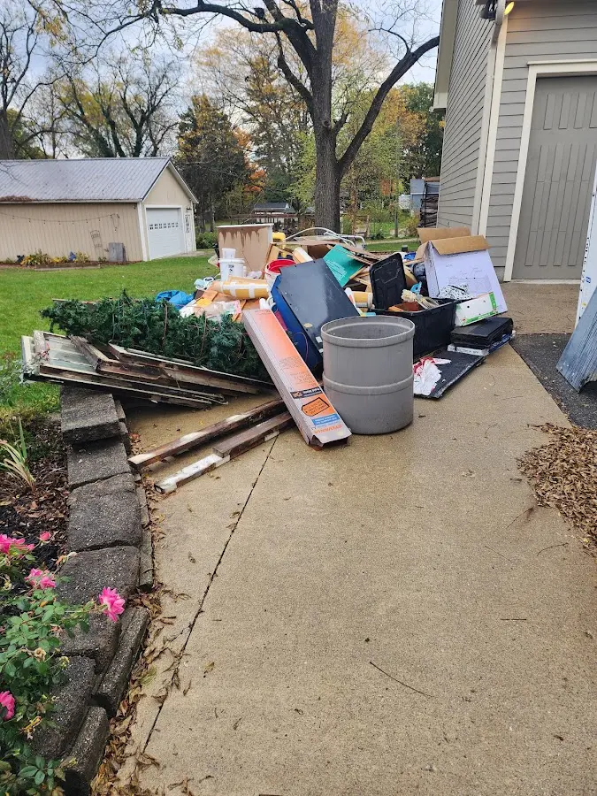 Dumpster being loaded with debris for Commercial Dumpster Rental in Murphysboro